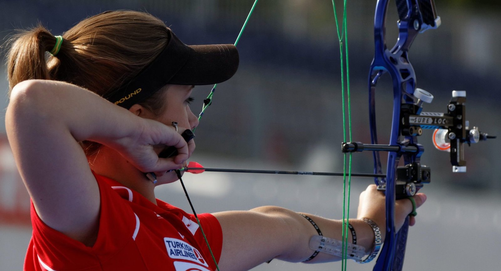 An archer at full draw on the shooting line