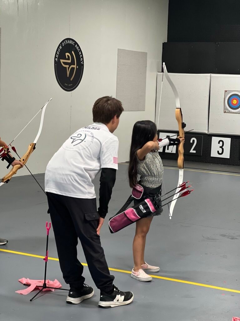 JOAD student helping Explorer's' student with technique