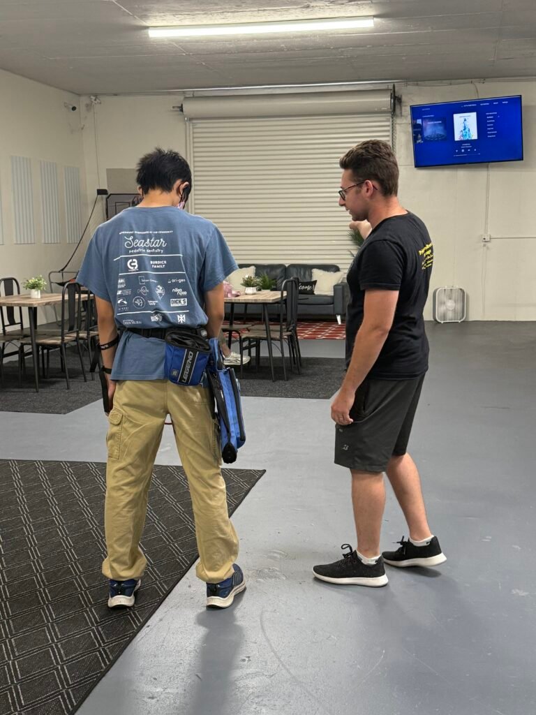 Student watching coach