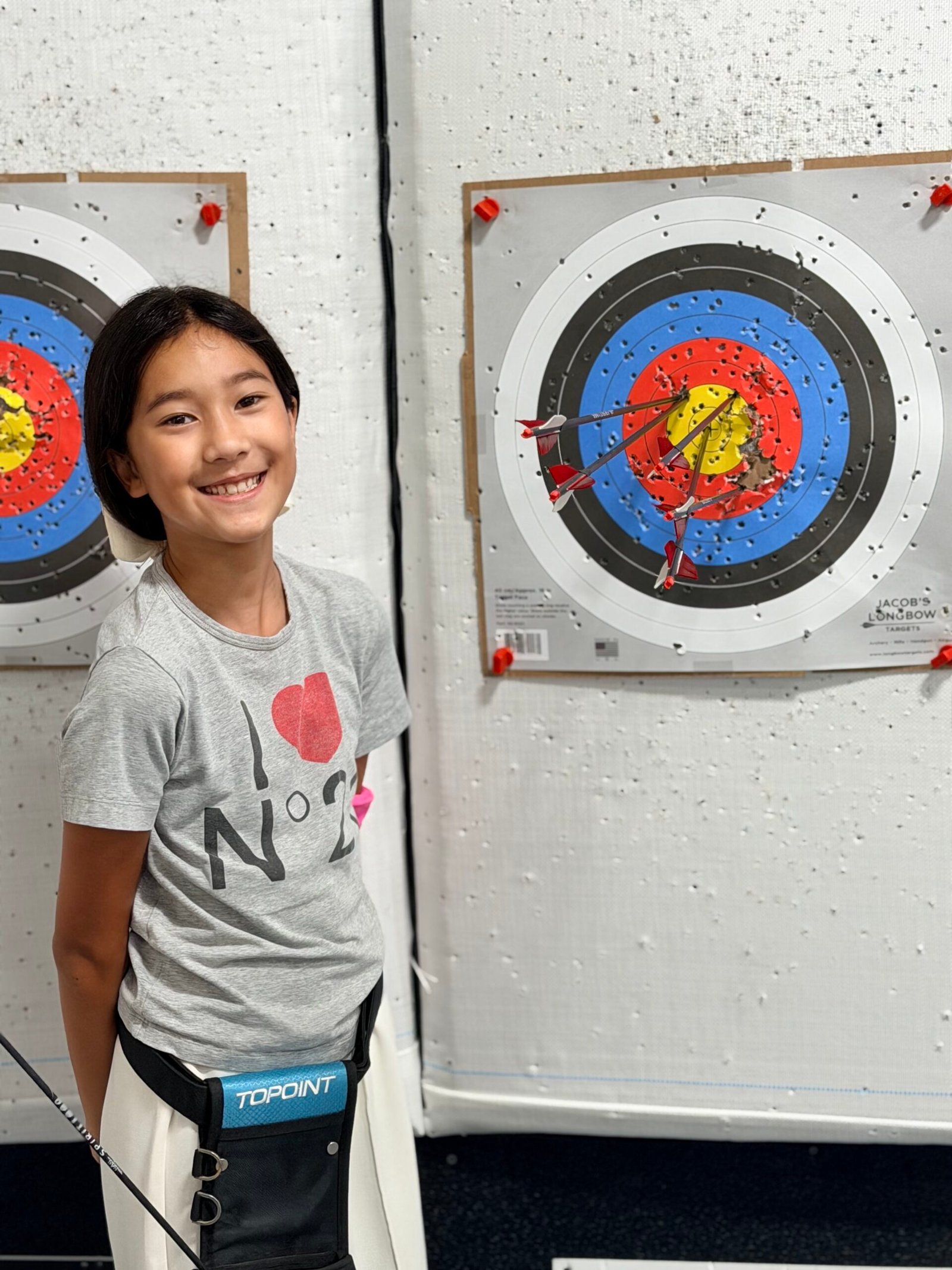 A young archer shooting during an Explorers class